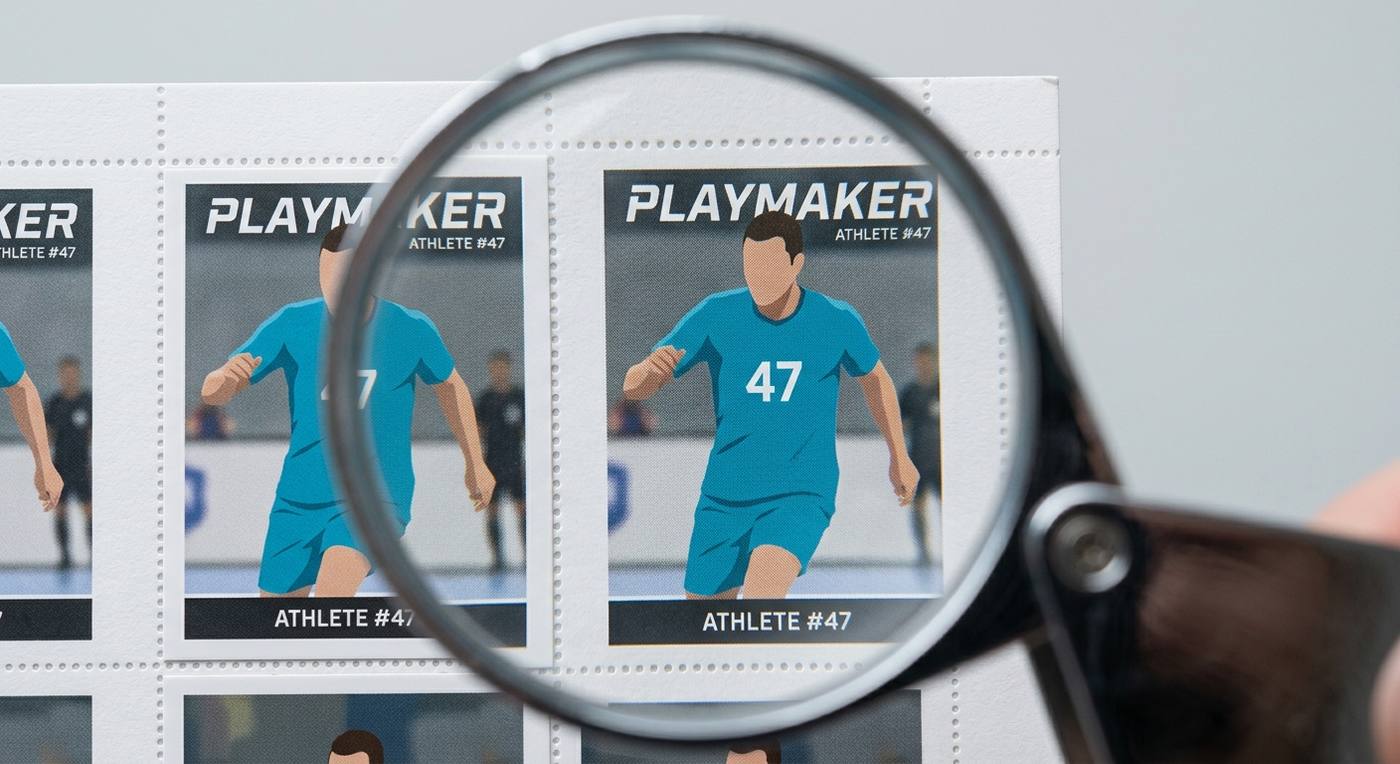 a loupe close-up of two cards from the same sheet: one with even borders, one with the image visibly shifted l